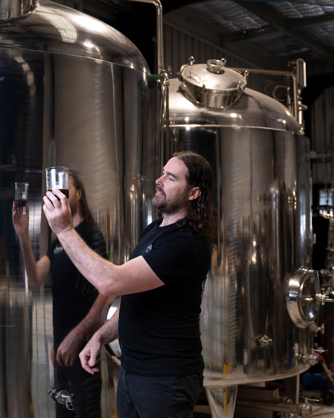 Master distiller Steve Grace inspecting Myrlèmon Australian vodka liqueur during the distillation process at the distillery.
