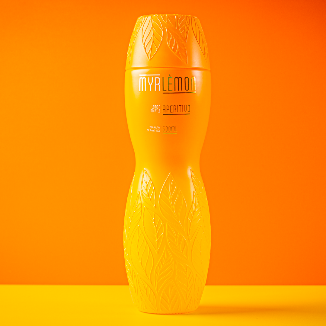 Bottle of Myrlèmon Australian lemon myrtle liqueur featured alongside the Golden Hour Spritz signature cocktail recipe with Prosecco and grapefruit.